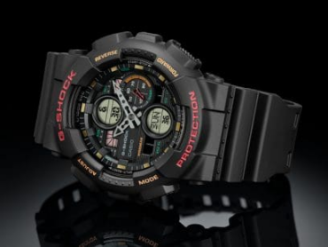 relogio-casio-GA-140-1A4 Foto do relógio Casio G-Shock GA-140-1A4 preto original com detalhes em vermelho e laranja, ponteiros em seta e mostrador analógico-digital para uso masculino esportivo.